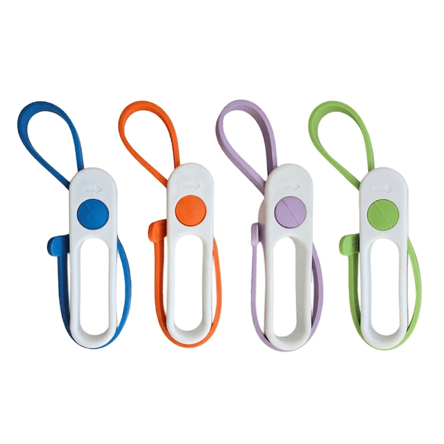 Fyra Lollipop locköppnare i rad, med blå, orange, lila och grön gummirem och vita handtag