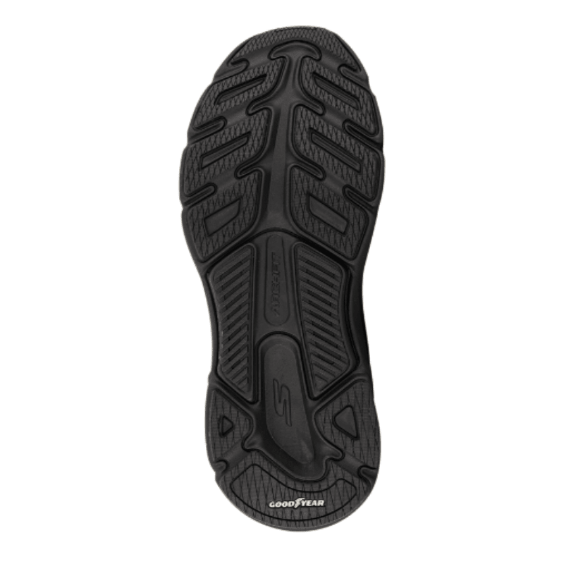 Svart Skechers damsneaker, undersidan av sulan med mönster och Goodyear-logotyp