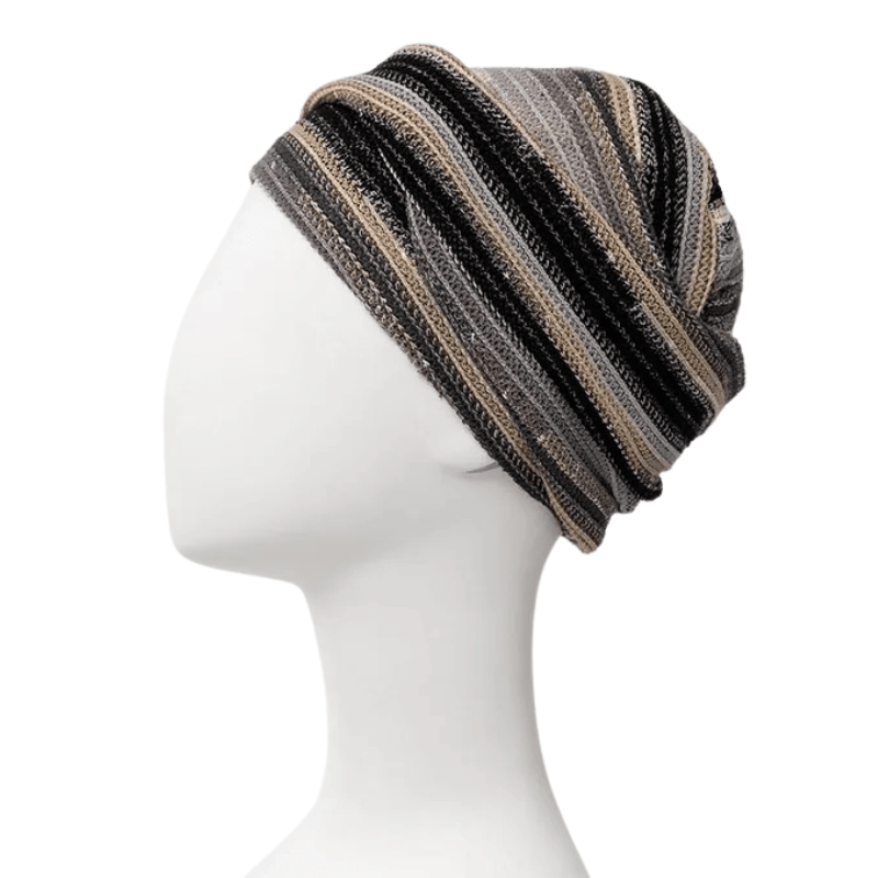 Zoya turban i Black Autumn Stripes på vit skyltdocka, sedd från sidan