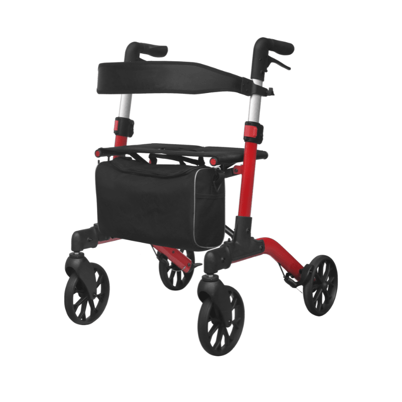 Röd Mambo rollator med svart avtagbar väska under sitsen, sedd snett framifrån