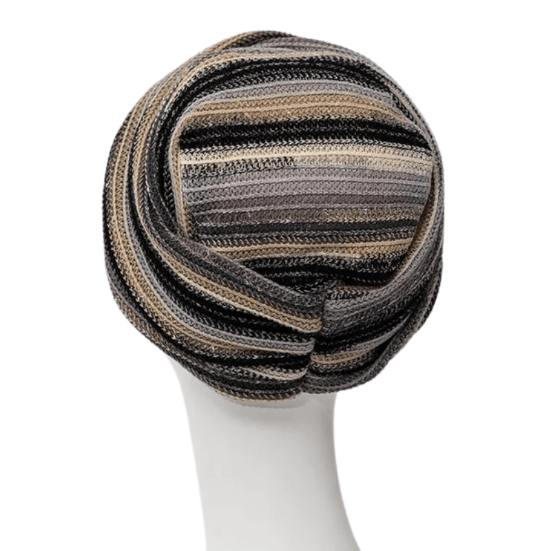 Zoya turban i Black Autumn Stripes sedd uppifrån, med tydligt randigt mönster och form