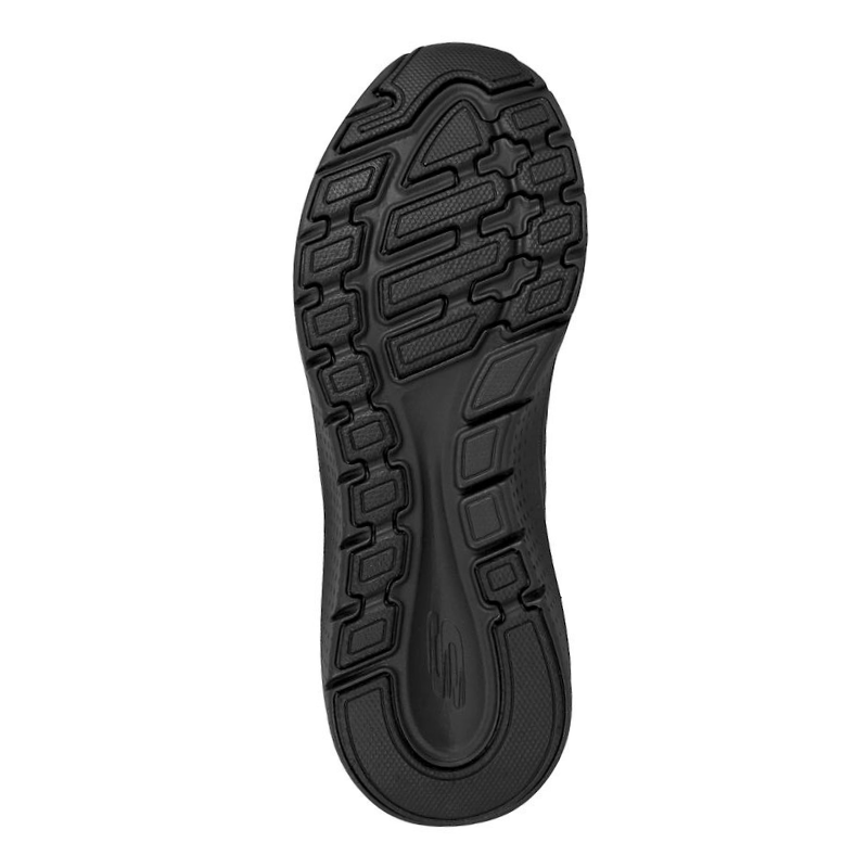 Undersidan av en svart Skechers damsneaker, visar den halkfria mönstrade yttersulan