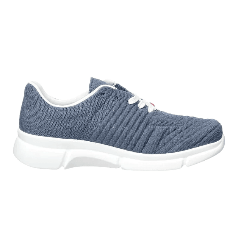 Berkemann damsneaker i denimblå med stickad ovandel och vit sula, sedd från sidan