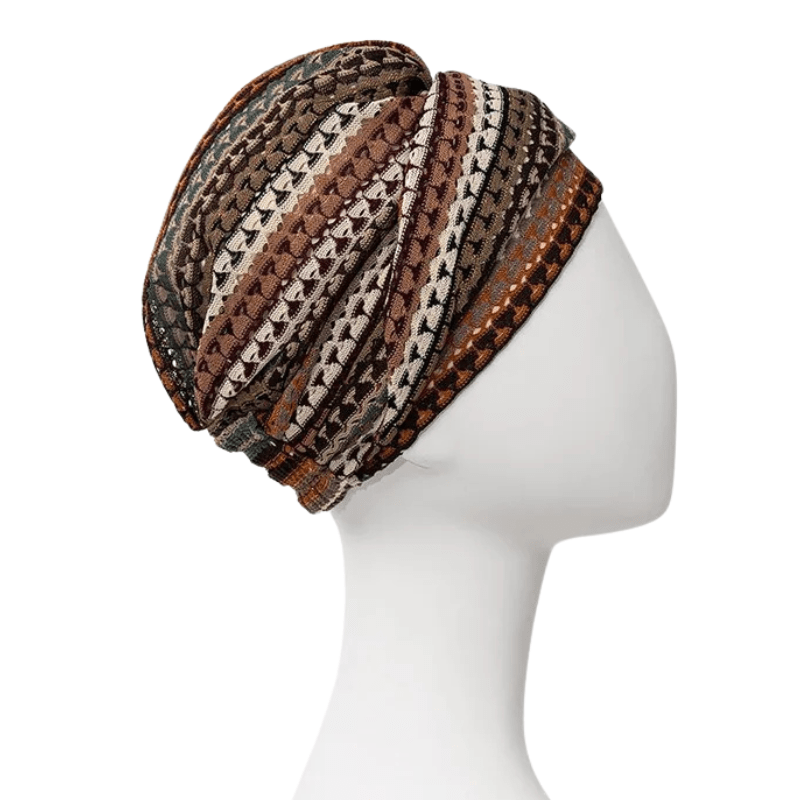 Sapphire Boho turban Autumn Lace med dess eleganta drapering och volym, stickad i mönster av bruna och guldfärgade nyanser