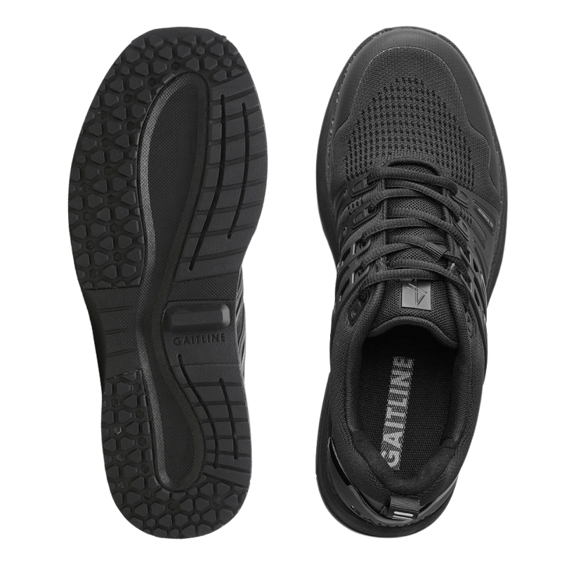 En svart Gaitline Advance Lite herrsneaker sedd ovanifrån bredvid en sula som visar mönstret