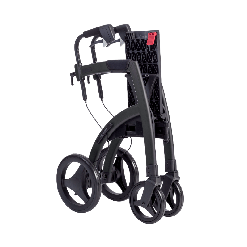 Hopfälld svart Rollz Motion rullator och rullstol, redo att transporteras eller förvaras