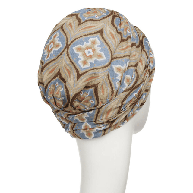 Baksidan av en Shakti turban i bambusviskos med ett vackert mönster i beige, brunt och blått