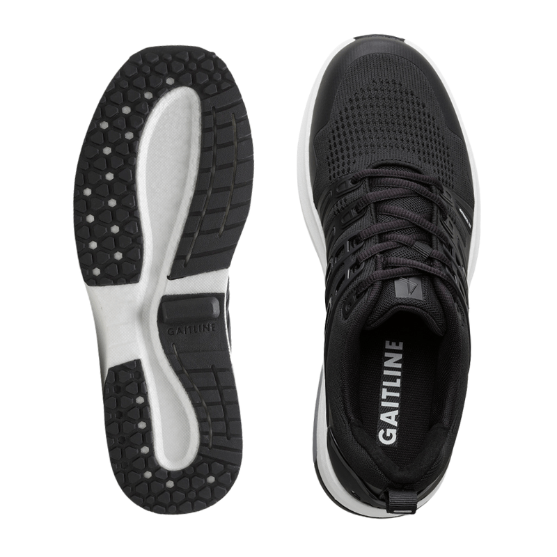Topbillede af en sort Gaitline herresneaker og dens skridsikre ydersål med Gaitline logo