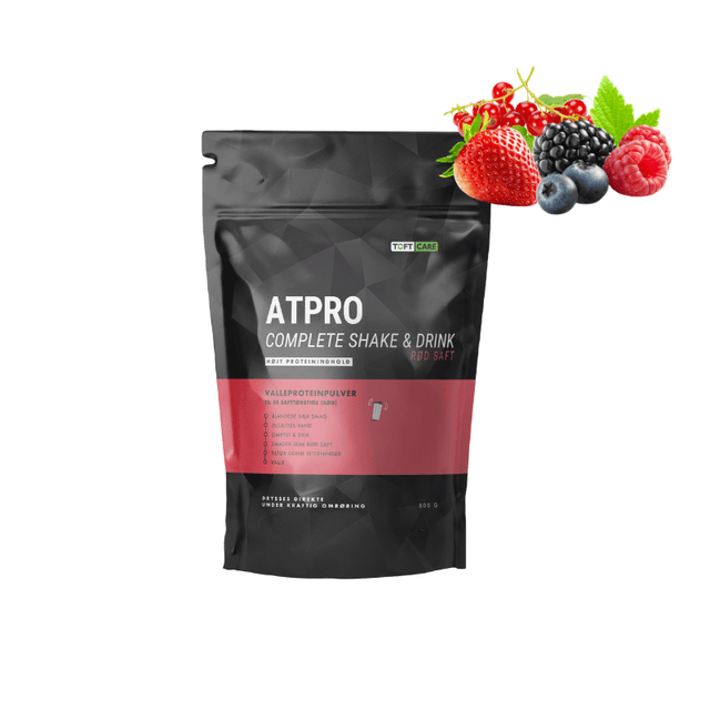 Svart påse Atpro Complete Röd proteinsaft med färska jordgubbar, hallon, blåbär och vinbär som indikerar smak