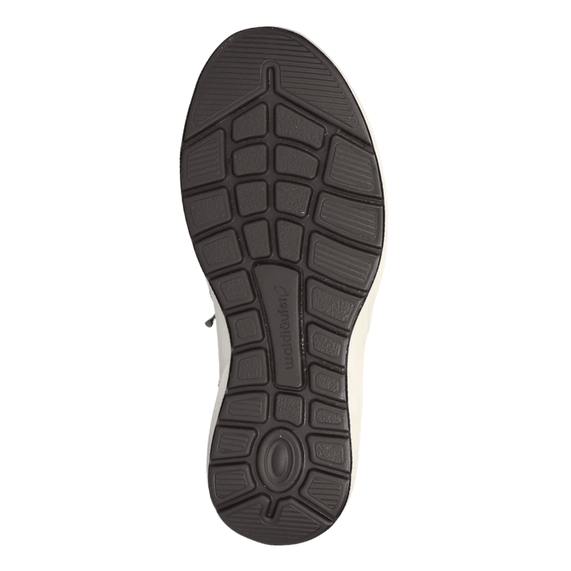 Svart flexibel yttersula på en Waldläufer damsneaker med mönster för bra grepp och logotyp i mitten