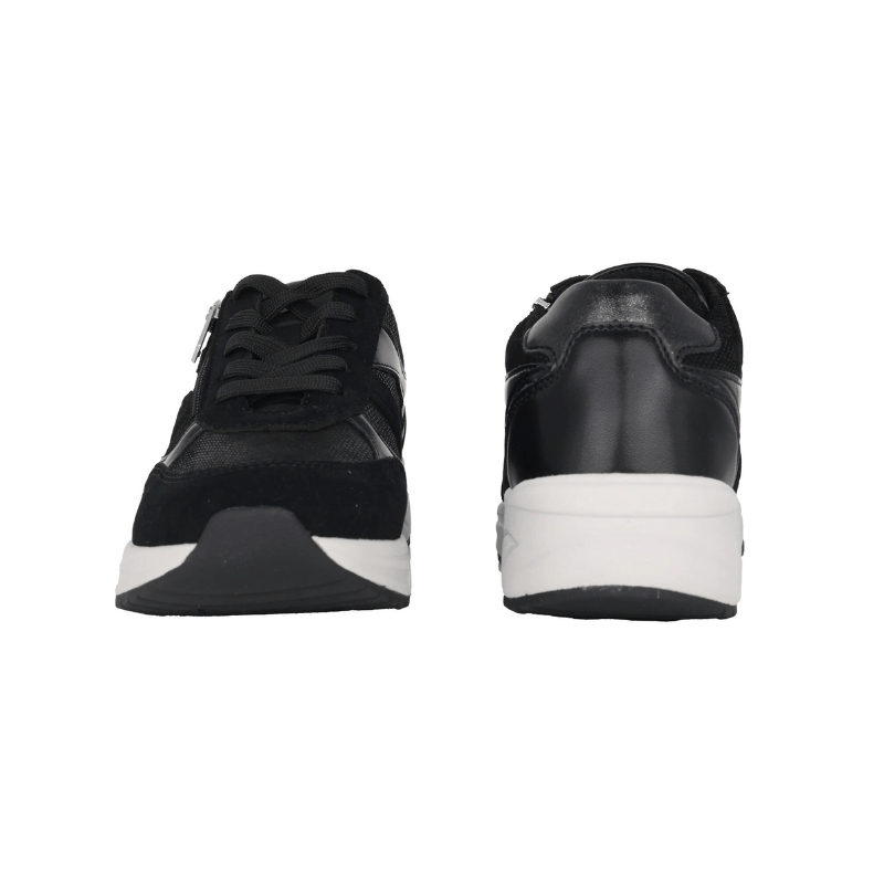 En svart Waldläufer damsneaker sedd framifrån och en sedd bakifrån, båda med vit sula