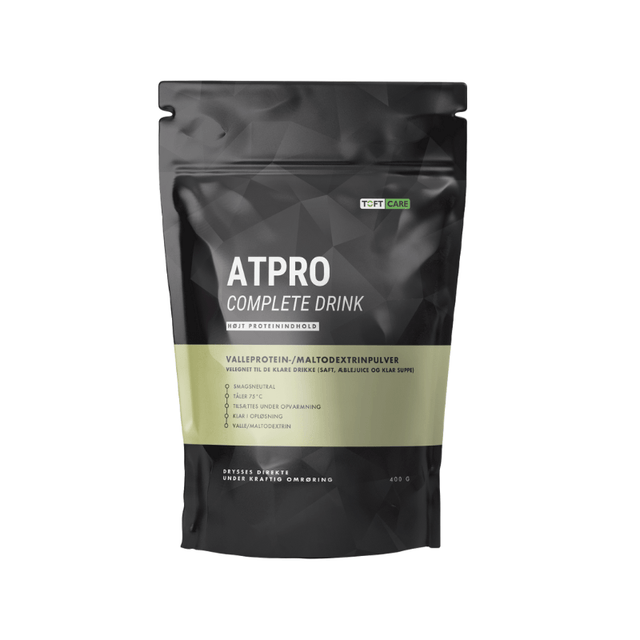 Sort Atpro Complete Drink ernæringstilskudspose med grøn detalje og Toft Care logo, set forfra