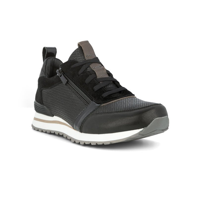 Svart Green Comfort retro damsneaker, sedd snett framifrån med snörning, dragkedja och mönstrad sula