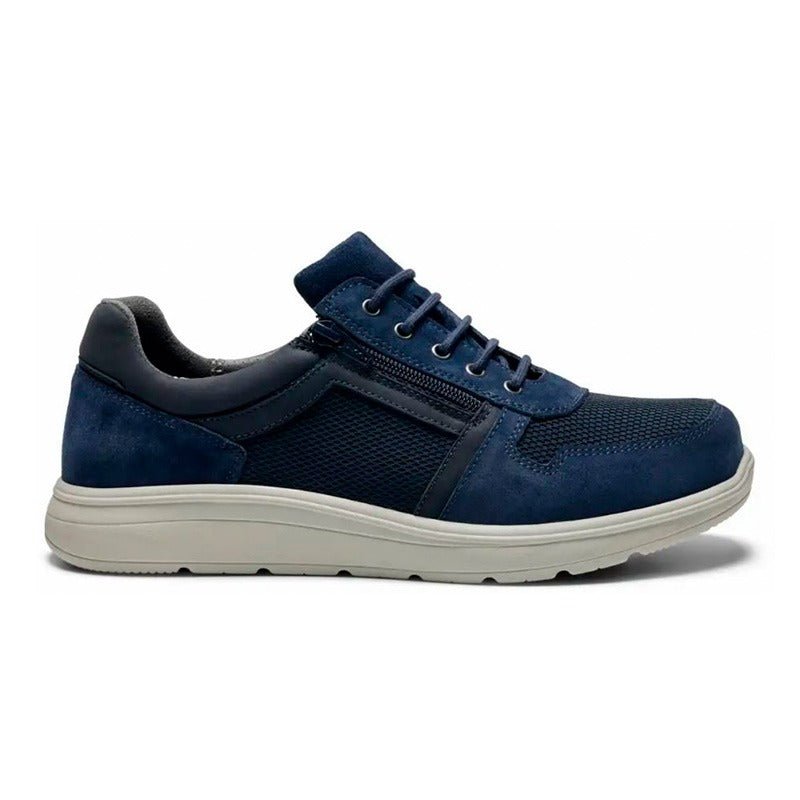 Mörkblå New Feet herrsneaker med snörning och dragkedja, sedd från sidan på vit bakgrund