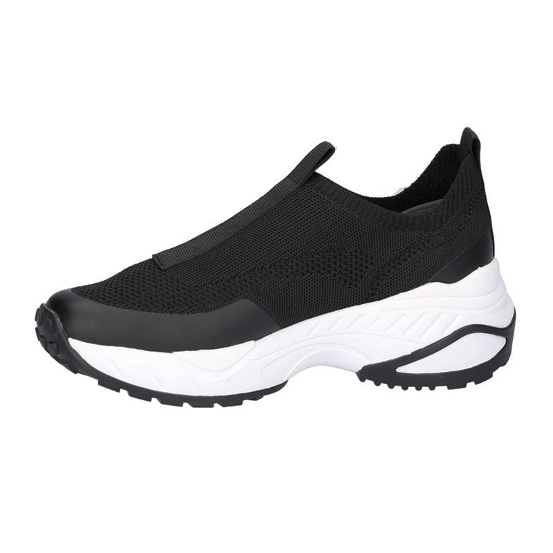 Svart och vit Waldläufer damsneaker med slip-on design och tjock vit sula med mönster, sedd från sidan