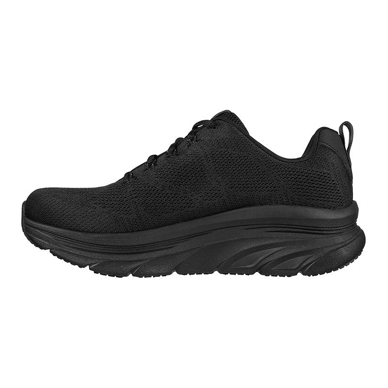 Svart Skechers damsneaker sedd rakt från sidan, visar den bekväma designen och tjocka sulan