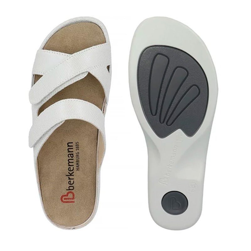 Hvid Berkemann dameslipper set oppefra med udtagelig indersål ved siden af, der viser ergonomisk design