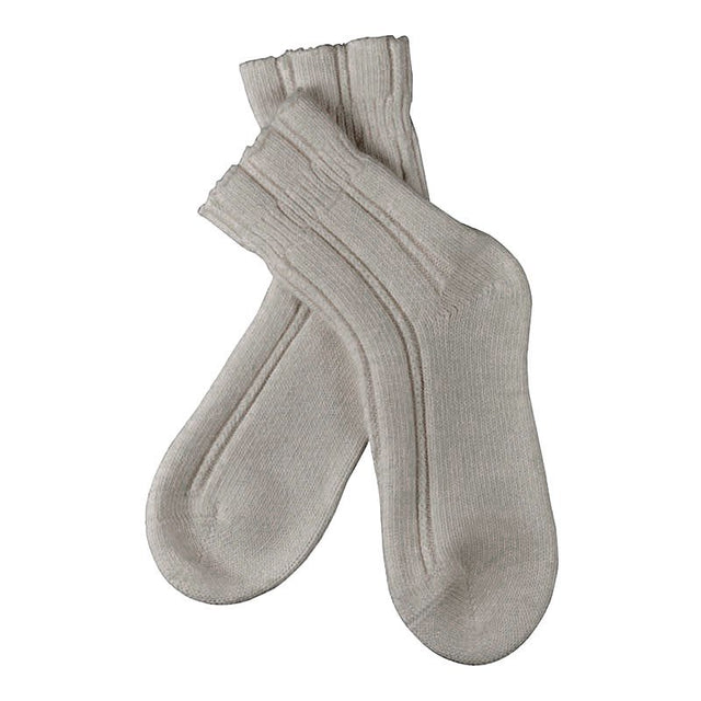 Två grå Falke nattsockor med angoraull, mjukt ribbstickade, korslagda och sedda uppifrån