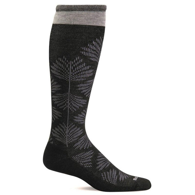 Sort Sockwell støttestrømpe med gråt blomstermønster og grå kant, vist fra siden