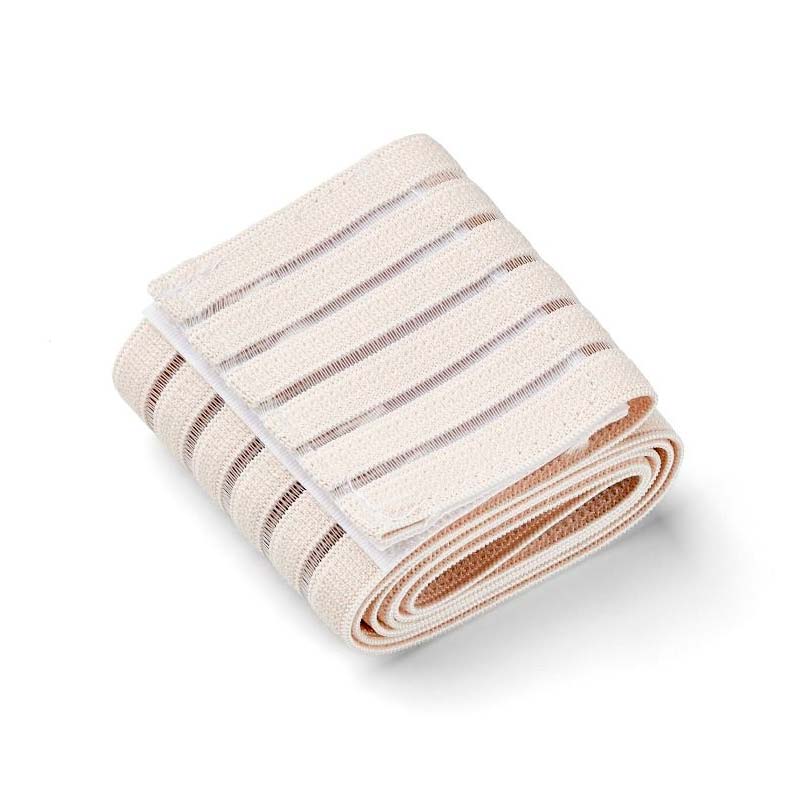 Beige elastiskt bandage vikt för att visa den ribbade strukturen och insidan