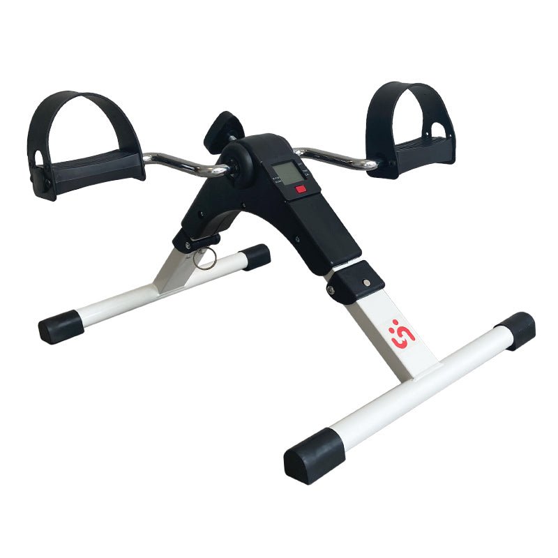 Vit hopfällbar digital pedaltränare sedd framifrån med svarta pedaler och display