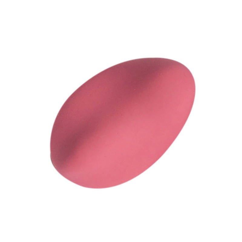 Rosa Nyx vibrator, oval och slät, fotograferad snett uppifrån på vit bakgrund