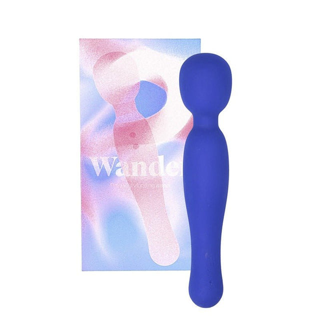 Blå Wander vibrator stående bredvid sin förpackning med abstrakt design