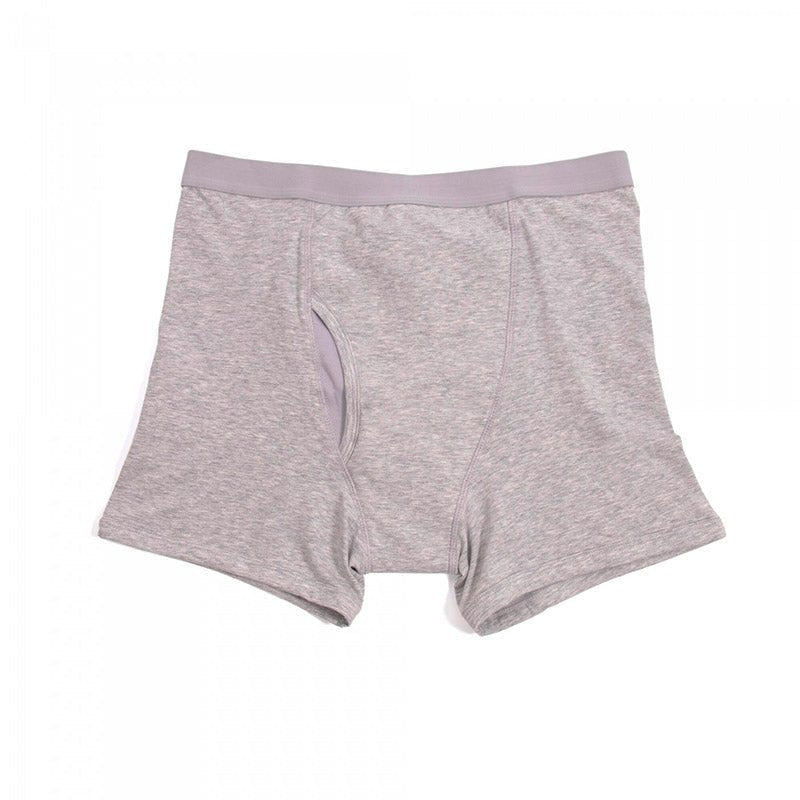 Grå boxershorts för inkontinens, platt bild framifrån som tydligt visar gylfen
