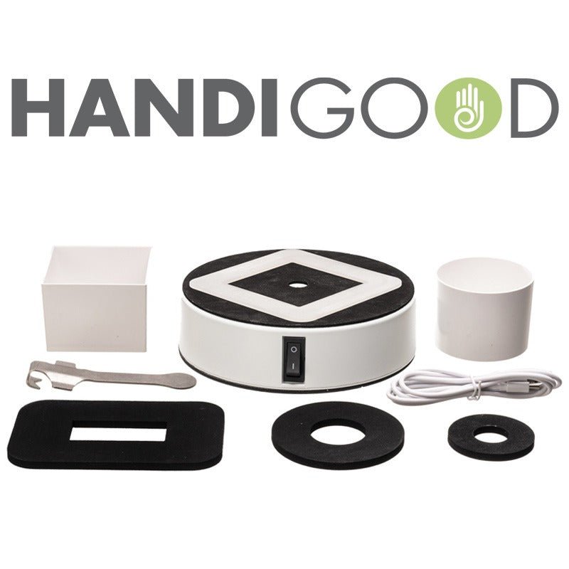 Alla delar av HandiGood Easy-Up® hållaren med tillbehör, inklusive kablar och ringar, utspridda