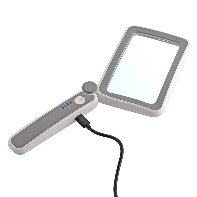 Foldbar læselup med LED-lys i hvid og grå, oplades via USB-C kabel