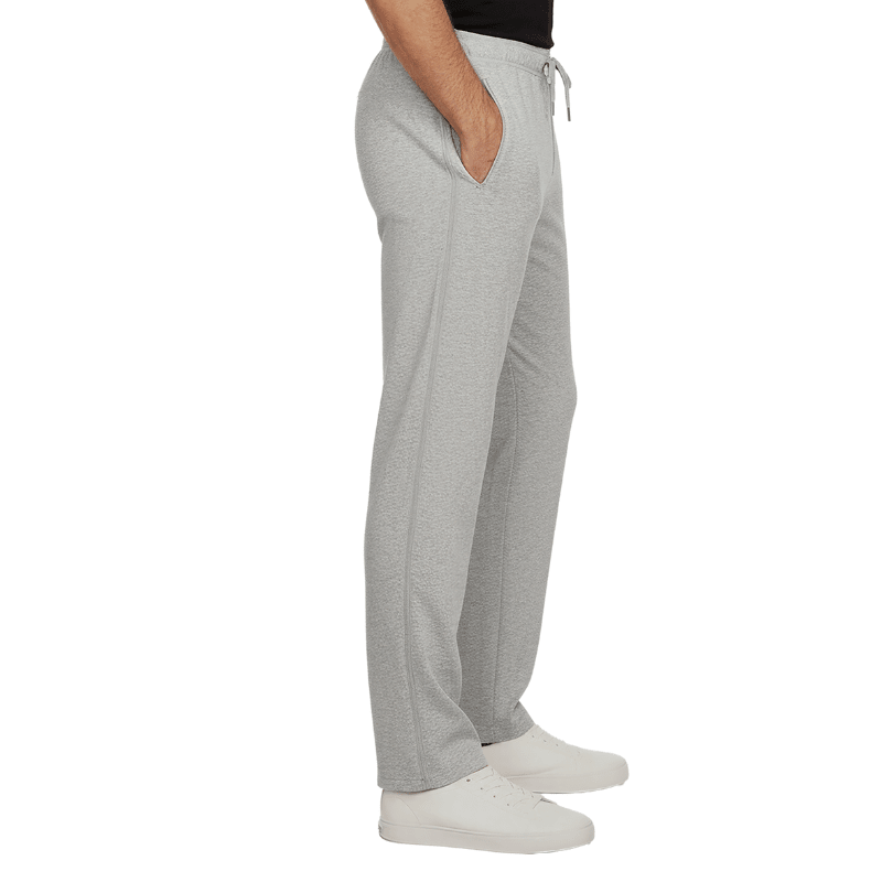 Grå sweatpants sedda från sidan med stängd dragkedja och sidficka